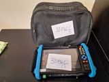 a bag that has a tablet in it on a table
