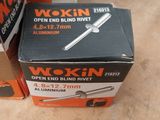 two boxes of wokin open end blind rivets on a table