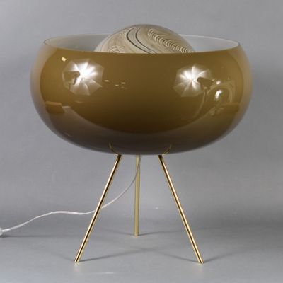 an image of a table lamp with a ball of yarn on it