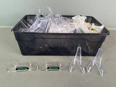 a plastic container filled with plastic items on a table