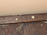 a close up of a piece of wood with a sign on it