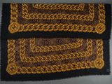 a close up of two brown and black rugs on a table