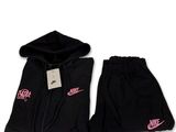 the nike hoodie and shorts are black and pink
