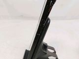 a cell phone that is sitting on top of a stand
