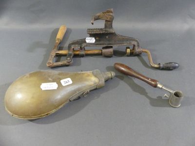two old tools sitting on a table next to each other