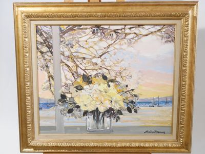 une peinture de fleurs dans un vase sur un chevalet