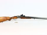a rifle with a wooden barrel on a white background
