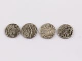 three silver coins are shown in a row on a white surface