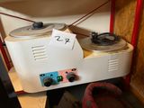 a record player that is sitting on top of a table