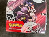 the box is full of pokemon trading cards on the table