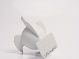 a small white rabbit figurine on a white surface