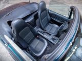 a picture of the interior of a car with the top down
