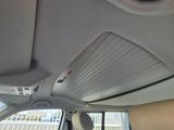 a view of the inside of a car from the driver ' s seat