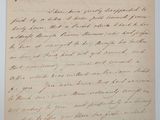 lettre manuscrite écrite à l'encre noire sur une feuille de papier