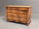 a wooden chest of drawers with three drawers on each side