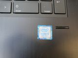 a close up of a computer keyboard with a sticker on it