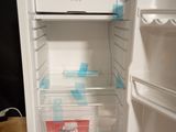 an open refrigerator with a lot of food inside of it