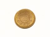 an image of a gold coin on a white surface