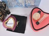 an image of a box of makeup and a heart shaped bag