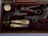 a wooden box with a set of tools inside of it