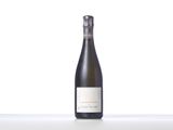 a bottle of wine sitting on top of a white table
