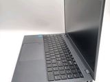a laptop that is sitting on a white surface