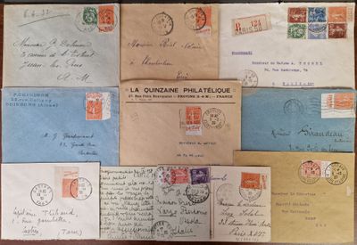 several old envelopes of different sizes and colors are on a table