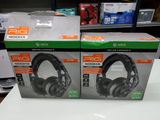 two boxes of headphones on a table in a store
