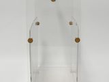 a clear acrylic display case with gold buttons