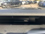 dashboard of a car with the number 100 on the dash
