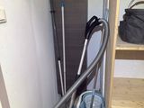 a vacuum that is sitting in the corner of a room