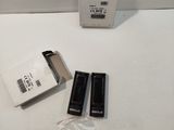 two batteries and a box of batteries on the table
