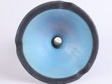 a blue and black object with a hole in it