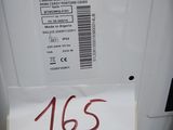 a label on the back of a white refrigerator