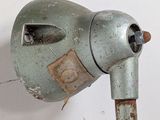 an old parking meter with a sticker on the side of it