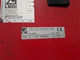 a red machine with a sticker on it ' s side
