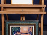 a picture of a painting on a easel with a picture on it