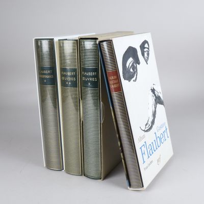 three books are stacked on top of each other on a table