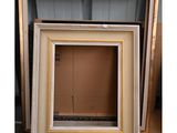 a group of three frames sitting next to each other on a floor