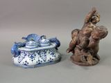 two figurines sitting next to each other on a table