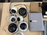 many cameras that are sitting on a table