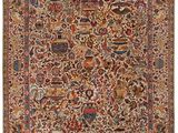 an antique persian rug with a floral design and fringes