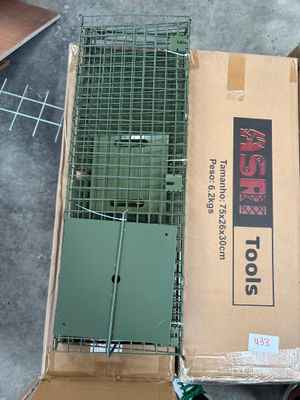 a box with a bird in it sitting on the floor next to a box with a bird in it