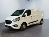 the white van is parked in a large room