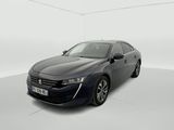 a black car in a white room with a white floor