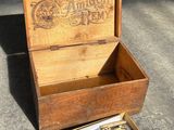 a wooden box that has a bunch of tools inside of it