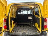 a yellow van that is parked in the parking lot