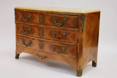 a small chest of drawers with a marble top