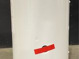 an image of a white water heater with a red sticker on it