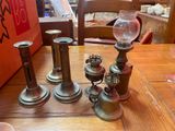 three candles that are sitting on a wooden table